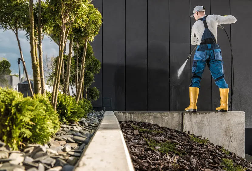 Pressure washing wall of a house