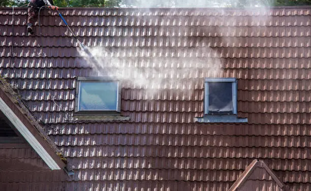 After roof cleaning product applied by js pristine cleaner