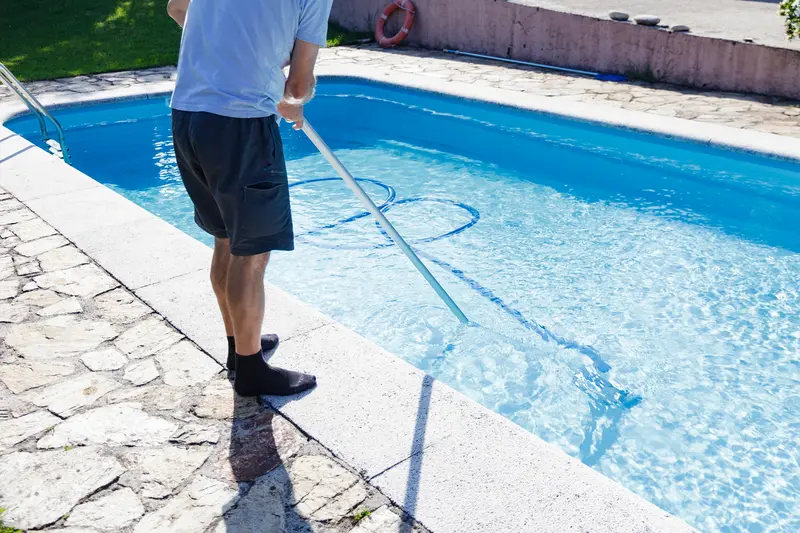 Removing dirt, mold, stains from pool using pressure washing