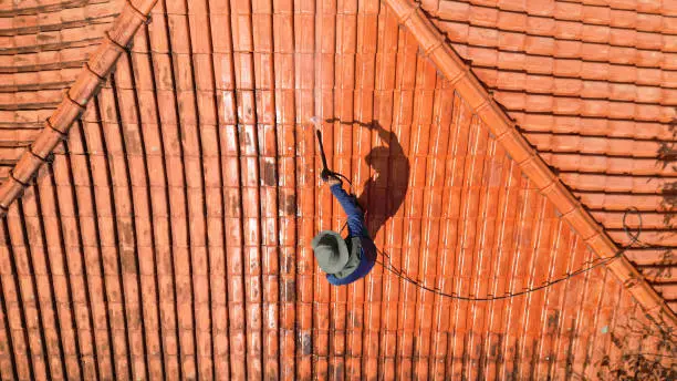 Applying product after roof cleaning for protection